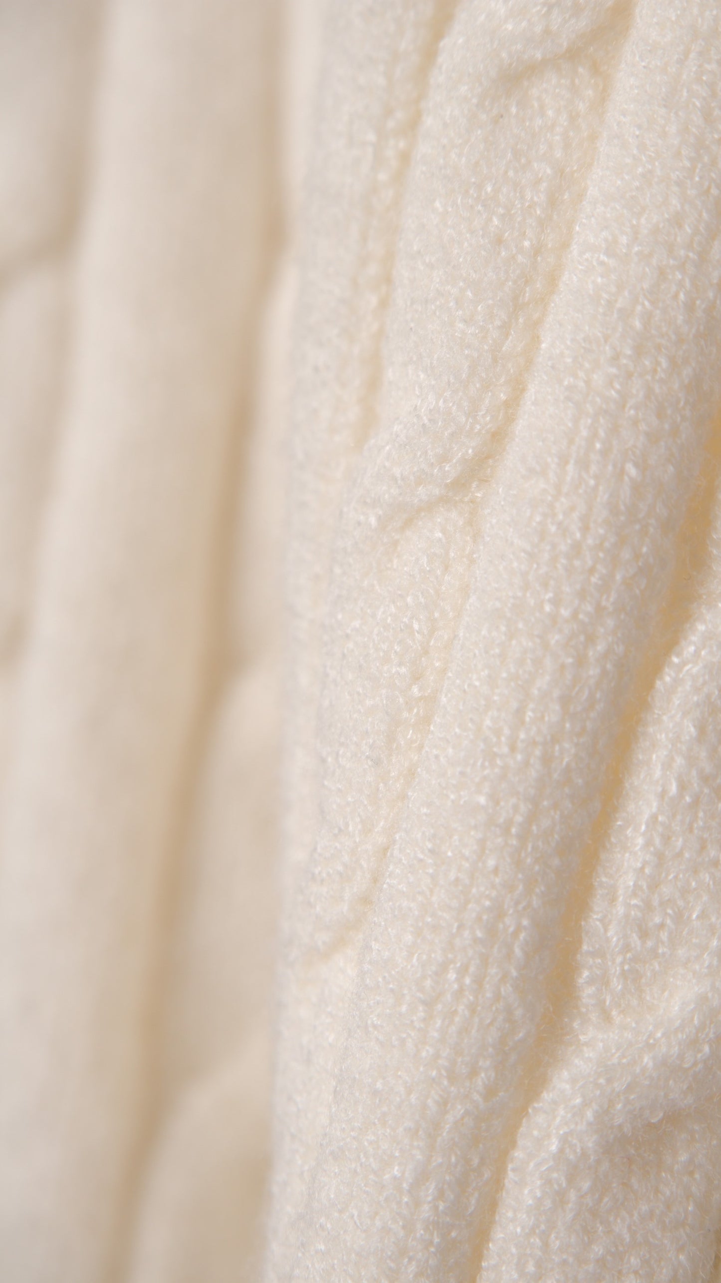 KNITTED SWEATER WITH EMBOSSED BUTTONS AND V-NECK