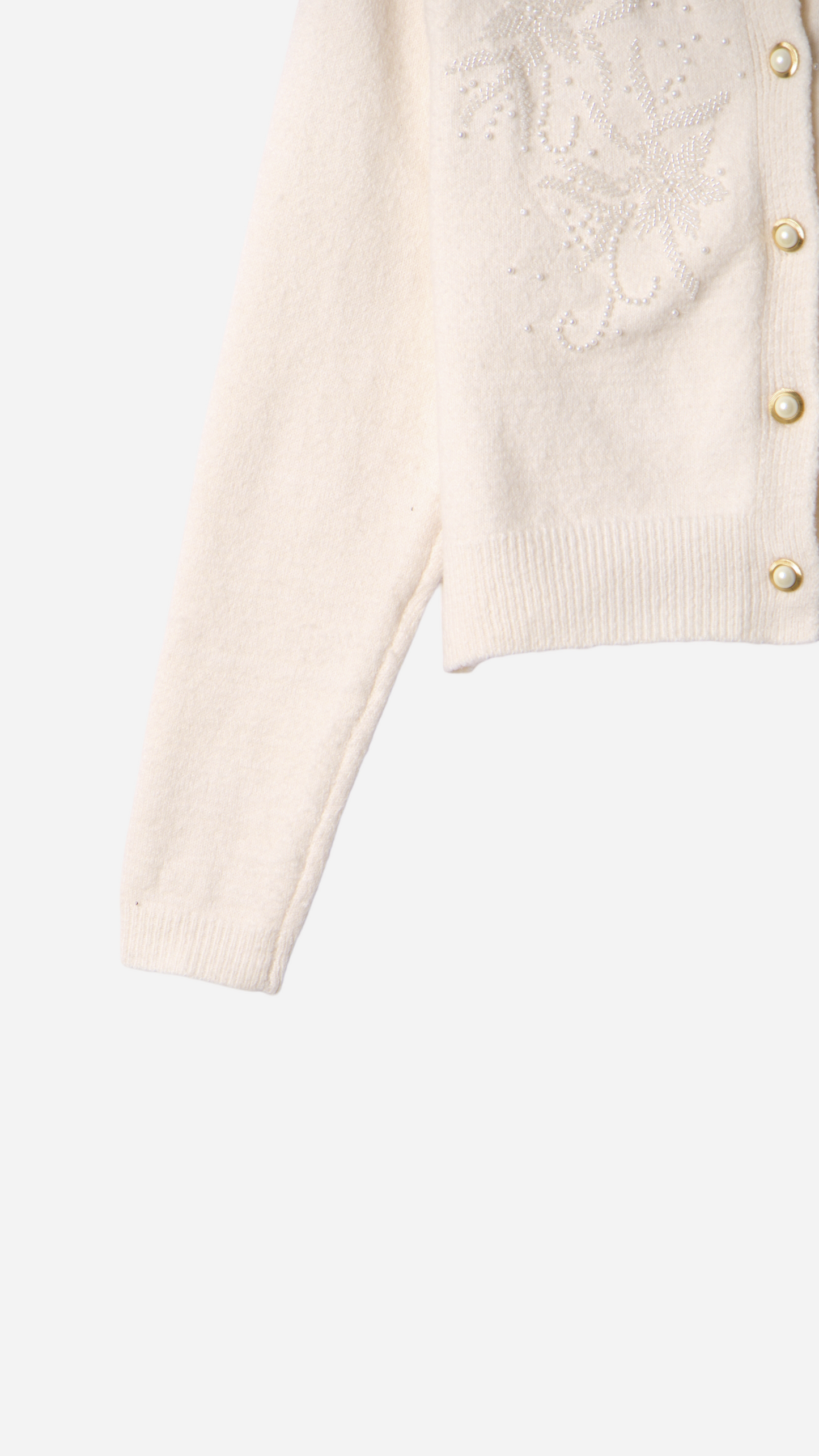 JERSEY WITH BUTTONS AND FLOWER DETAILS