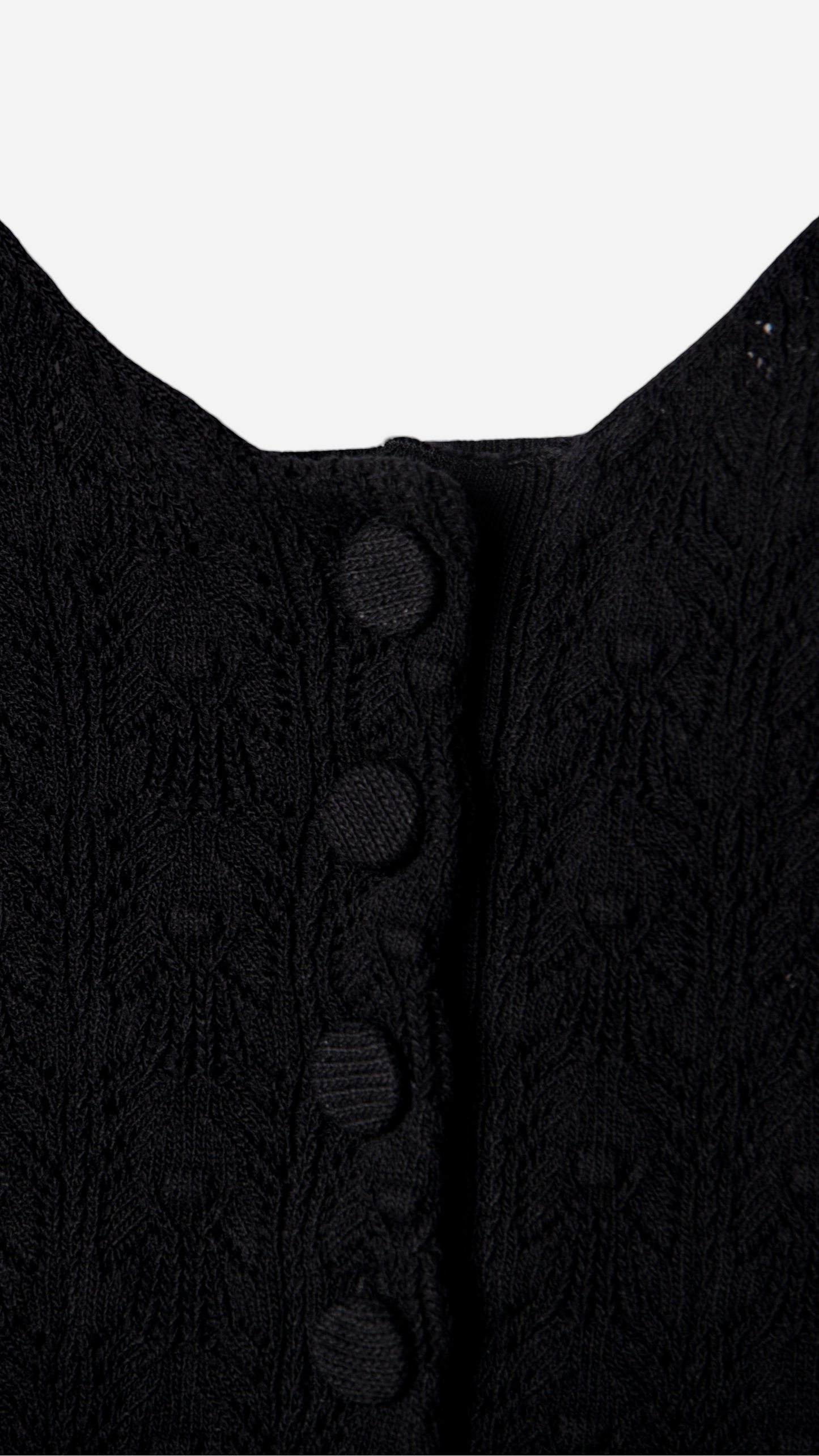 KNITTED TOP WITH BUTTON STRAPS