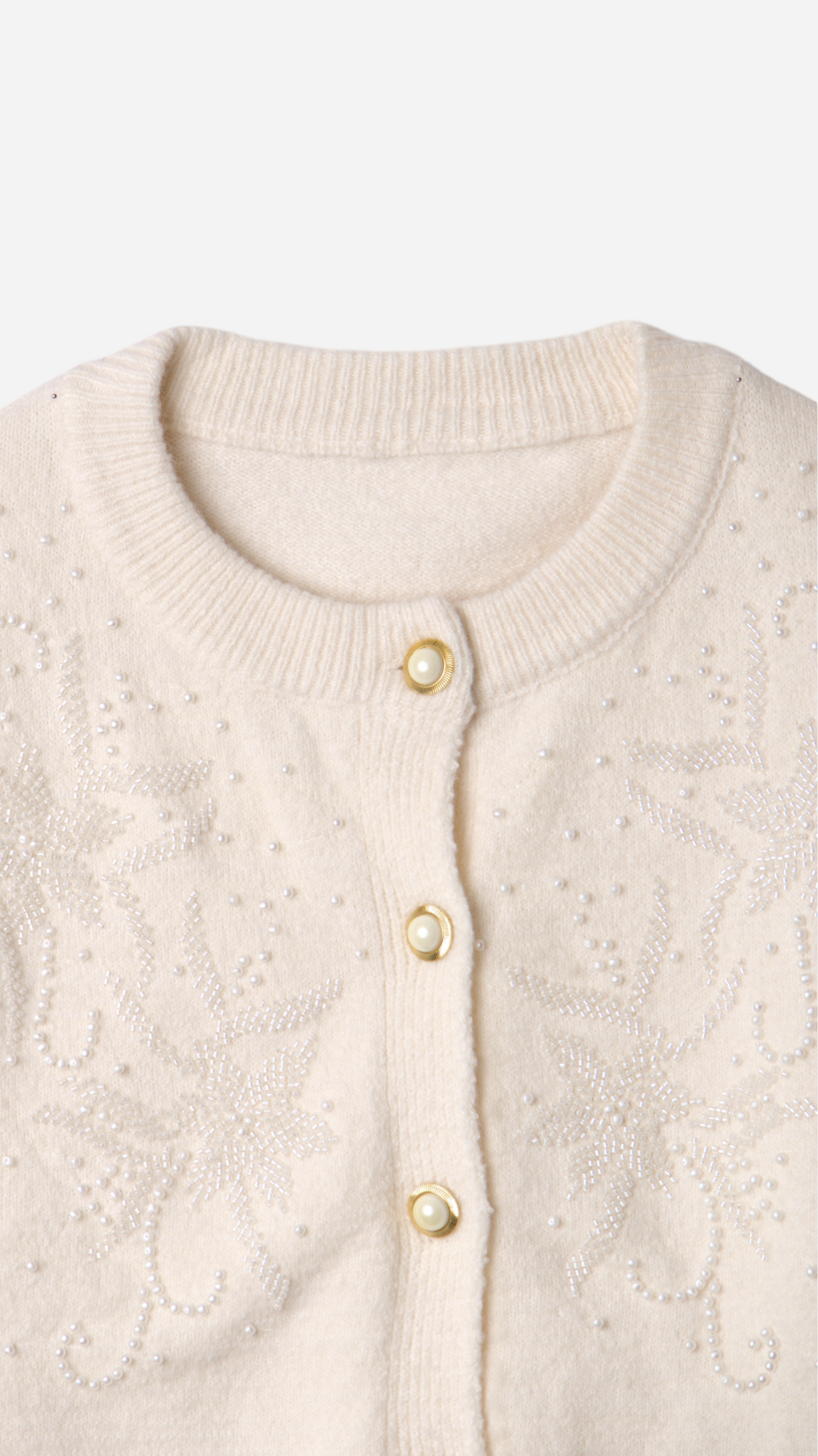 JERSEY WITH BUTTONS AND FLOWER DETAILS